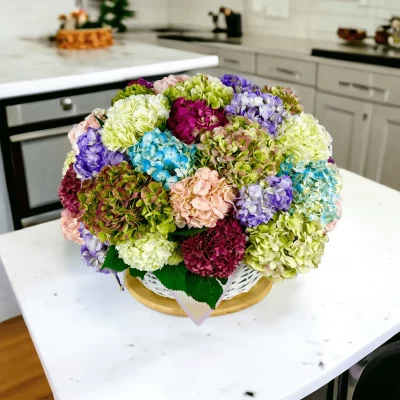 A beautifully crafted gift basket showcasing an abundance of hydrangeas, each stem contributing to a full and lush floral arrangement.