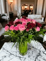 Striking combination of pink and red roses in a vase, ideal for expressing deep emotions