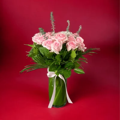 A full, vibrant bouquet of pink roses, artfully arranged for a stunning display.