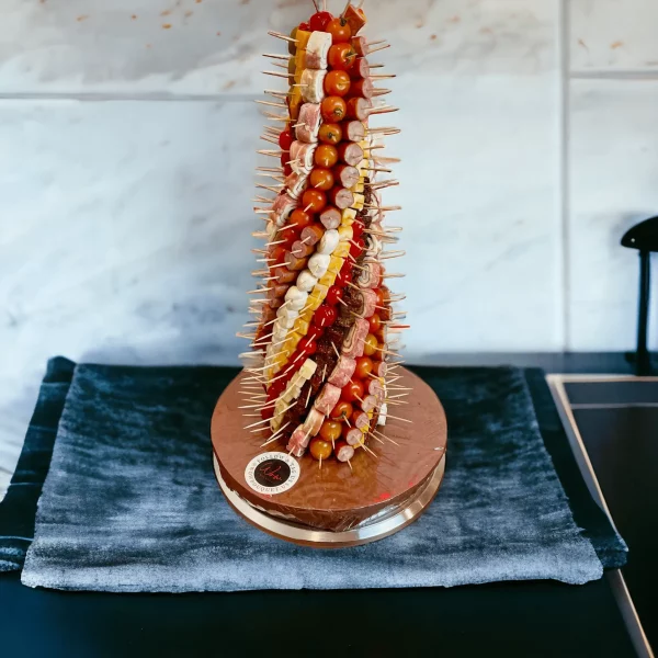 NYC's finest Charcuterie Tower centerpiece, combining luxury and taste with its selection of meats, cheeses, and dried fruits.