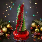 Christmas dessert tower featuring chocolate-dipped strawberries and red roses