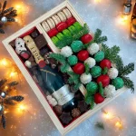 Handcrafted wooden Christmas gift box with festive sweets