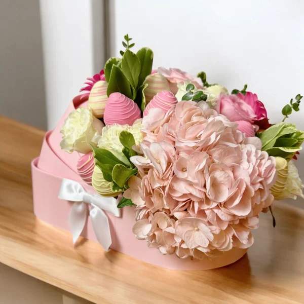 Beautiful baby gift box with cradle design, flowers, and chocolate strawberries