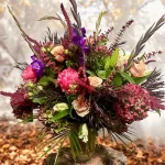 Fall-themed flower arrangement with pink and brown mix