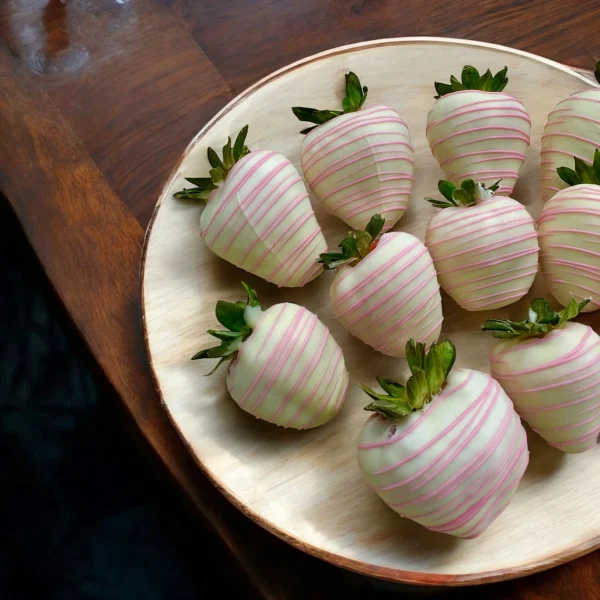 White chocolate strawberries with pink accents for anniversary gift