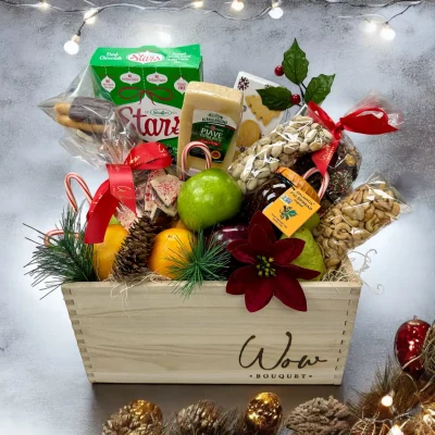 Top-down view of a festive Holiday Cheer Christmas Gift Basket.