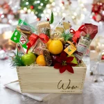 Top-down view of a beautifully arranged holiday gift basket.