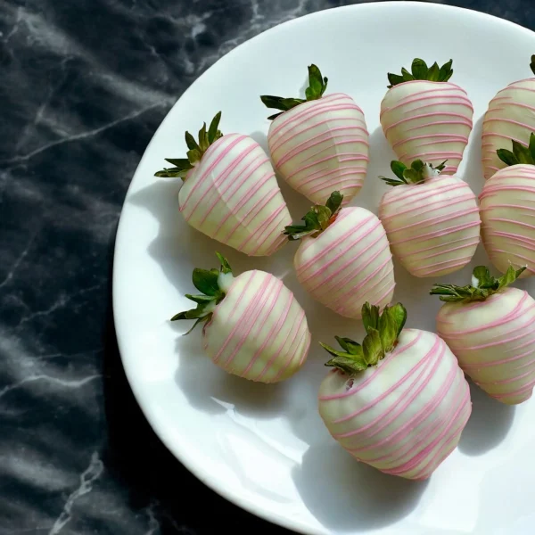 Fresh strawberries dipped in white Belgian chocolate for anniversary