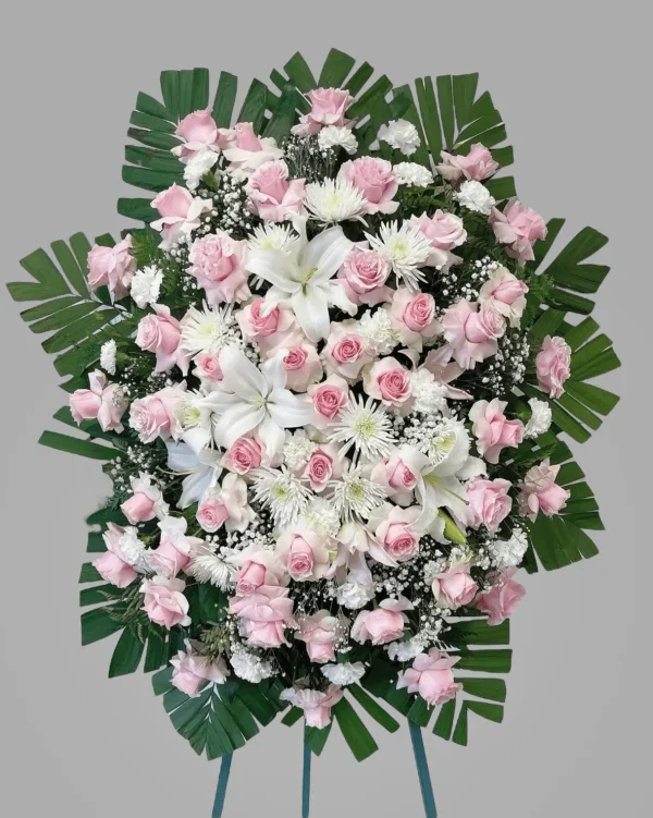 Detailed shot of baby’s breath complementing pink roses and lilies.