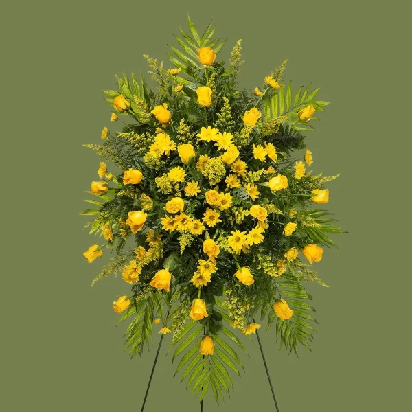 Profile view of a bright yellow floral arrangement for funerals.