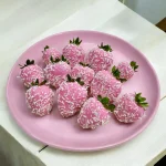 One dozen white Belgian chocolate-covered strawberries with coconut