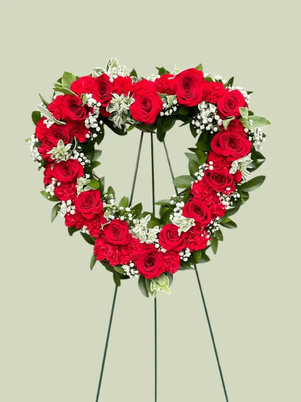 Profile view of a heart-shaped floral arrangement for funerals.