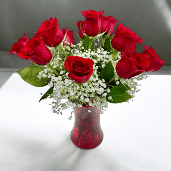 Hand-arranged red roses in a clear vase in Bergen County