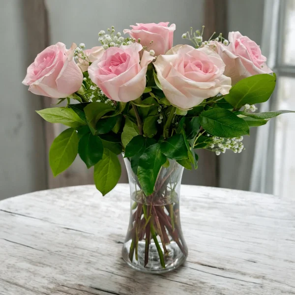 Pink roses in a vase, ready to send as a gift