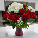 Side angle of a classic red rose and hydrangea arrangement