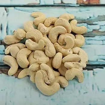 Smooth, oblong mangrove nuts, fresh and unprocessed, representing their mild, nutty taste.