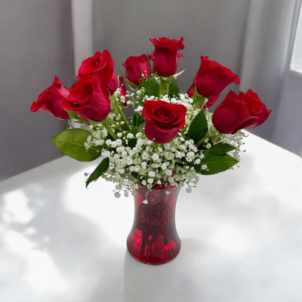 Hand-arranged red roses in a clear vase in Bergen County