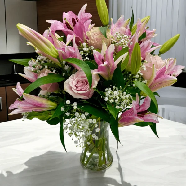 Fragrant pink lilies and pink roses ready for gifting