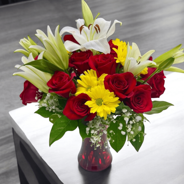 Colorful blend of daisies, lilies, and red roses for local delivery