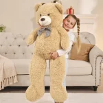 Giant teddy bear with a ribbon around its neck