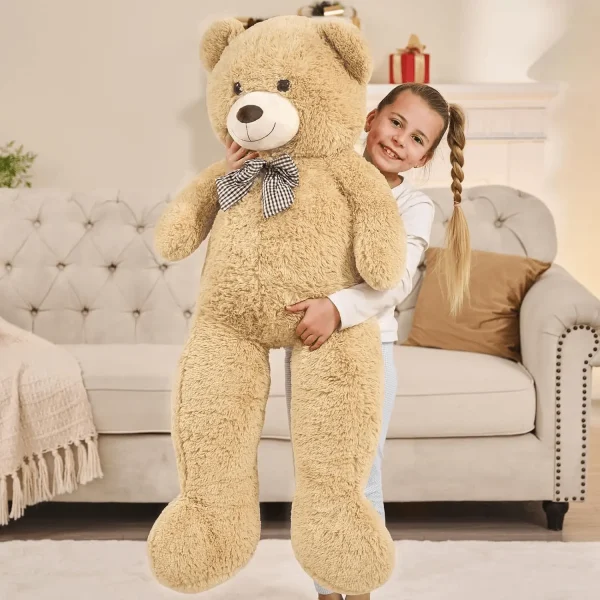 Giant teddy bear with a ribbon around its neck