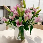 Deluxe bouquet of pink lilies and pink roses in a vase