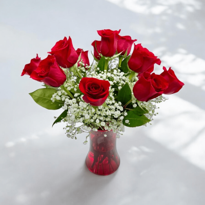 Floral arrangement of deluxe red roses in a vase