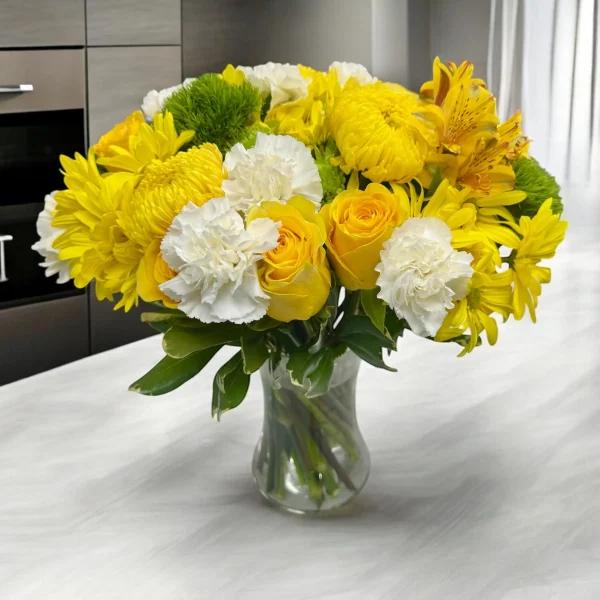 Close-up of fresh yellow sunny flower mix daisies, mums, and roses in a bouquet