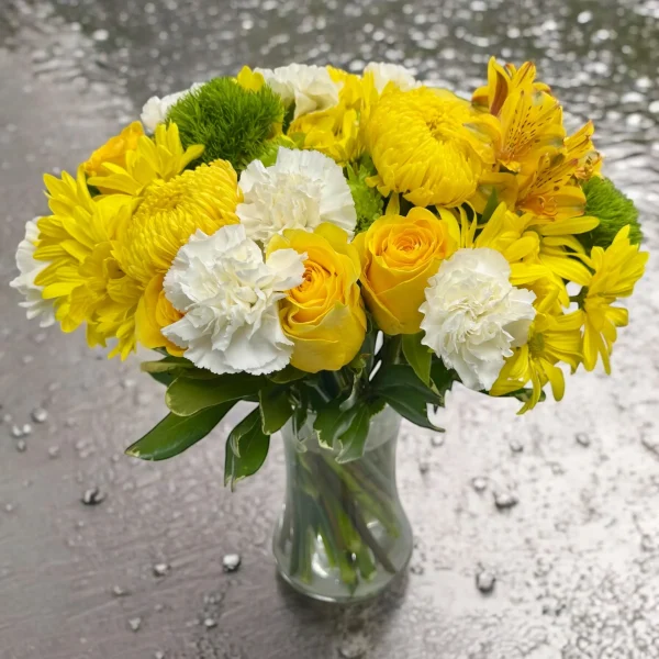 Hand-arranged sunny flower mix with white carnations