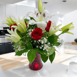 Hand-arranged bouquet of lilies and roses