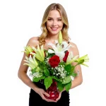 Fresh red and white flower arrangement with greenery and baby’s breath