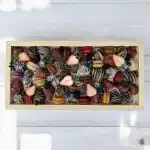 Top view of Chocolate Strawberry & Macaron Gift Tray with hand-dipped Belgian chocolate strawberries and assorted macarons.