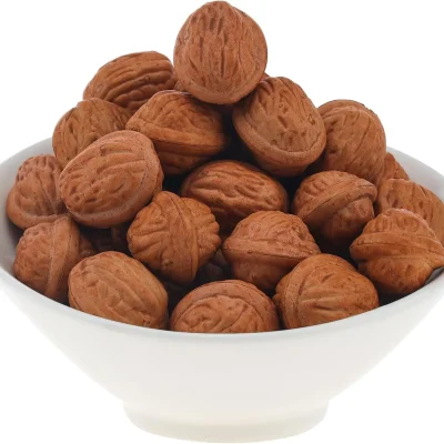 Shelled walnuts with a wrinkled, brain-like texture, showcasing their deep brown hue and earthy taste