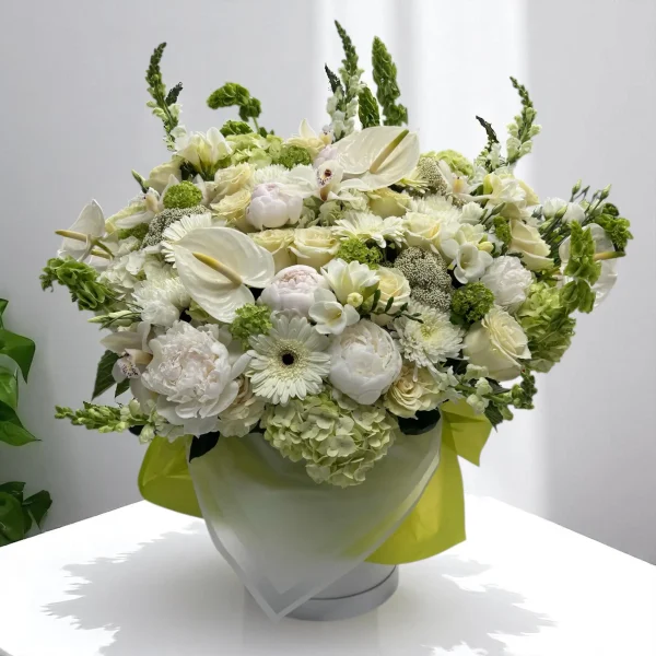 Luxury white flower bouquet featuring mums, snapdragons, and lisianthus