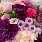 Seasonal purple and pink blooms arranged by WOWBouquet florist