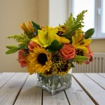 Bright flower mix bouquet with sunflowers and lilies