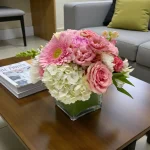 Soft pink rose arrangement featuring hydrangea, gerbera, and mixed flowers