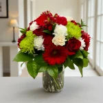 Fresh vase arrangement prepared for Christmas flower delivery
