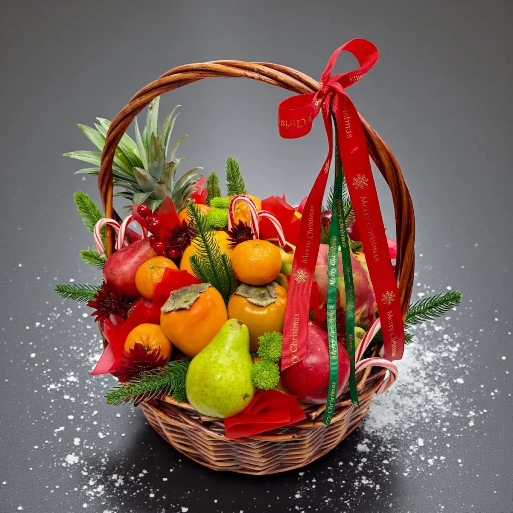 Festive Christmas fruit basket decorated with ribbons and winter accents