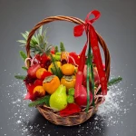 Festive Christmas fruit basket decorated with ribbons and winter accents