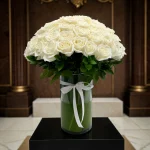 top view of 100 long stem roses in a vase NYC arrangement