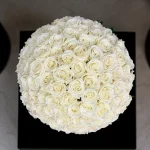 100 long stem roses in a vase NYC with greenery and vase