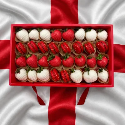 World Cup England sweets box featuring chocolate dipped strawberries and macarons arranged in team colors