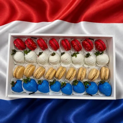 World Cup Netherlands sweets box featuring chocolate dipped strawberries and macarons arranged in team colors