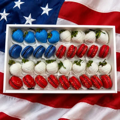 World Cup USA sweets box featuring chocolate dipped strawberries and macarons arranged in team colors
