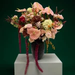 Grand flower arrangement with cascading burgundy amaranthus, tropical anthuriums, and premium seasonal blooms for Manhattan flower delivery