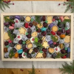 XL Christmas sweets gift tray with chocolate-covered strawberries, macarons and holiday cookies in a wooden box