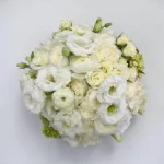 Top view of Manhattan Blanc white floral arrangement with premium roses, ranunculus and lisianthus