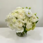 Manhattan Blanc elegant white floral centerpiece in a clear glass vase for Manhattan flower delivery